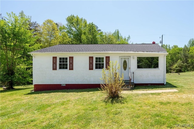 view of front facade with entry steps, a front yard, roof with shingles, and crawl space