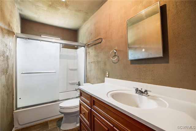 full bath featuring vanity, enclosed tub / shower combo, and toilet