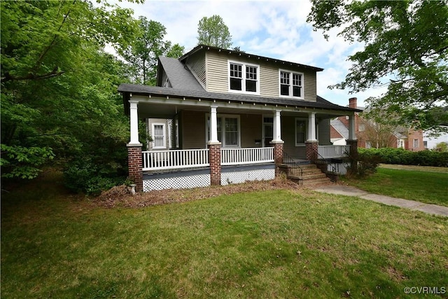 view of front facade featuring covered porch and a front lawn