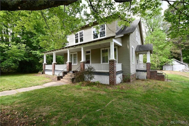 view of front of house with a porch and a front lawn