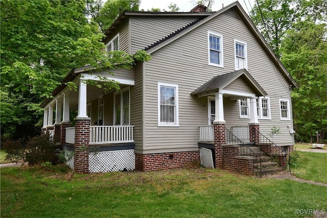 view of front of property with a porch and a front yard