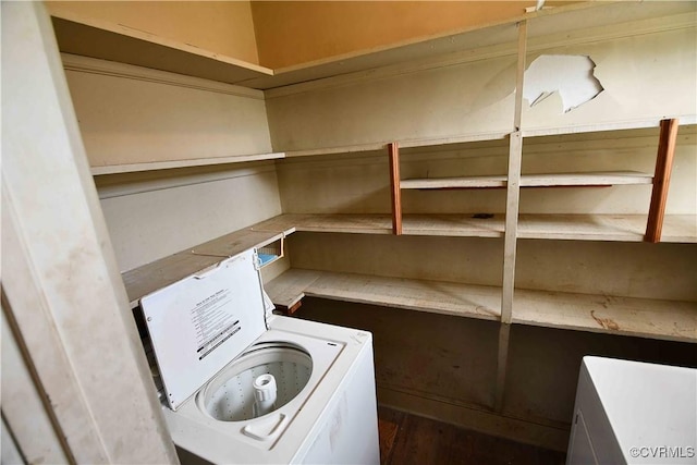 laundry area featuring washer / clothes dryer and wood finished floors