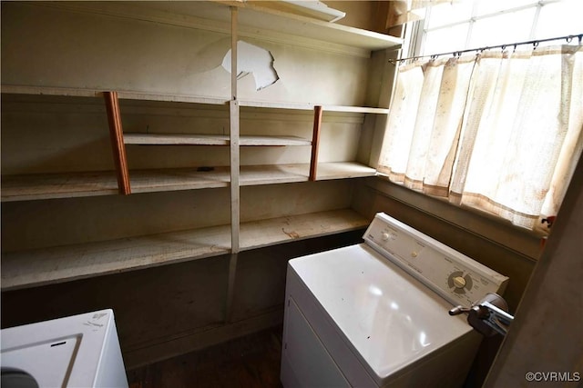 clothes washing area with laundry area and washer / clothes dryer