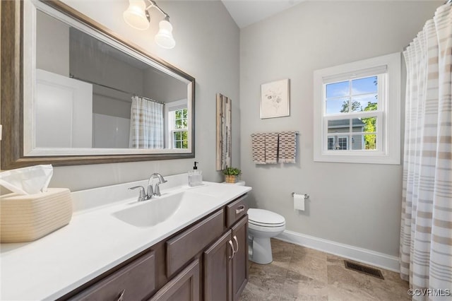 full bath with baseboards, toilet, and vanity