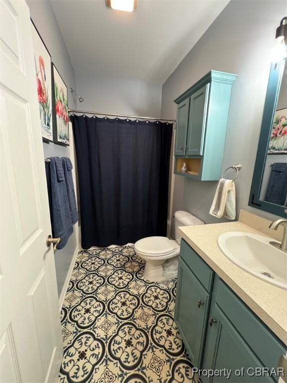497 Mill Wharf Rd, Wake, VA 23176 - bathroom featuring toilet, tile patterned floors, vanity, and curtained shower