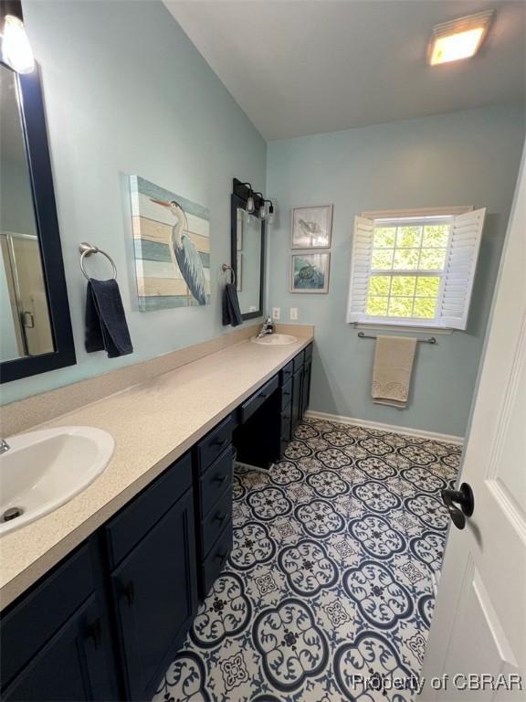 bathroom with baseboards and vanity