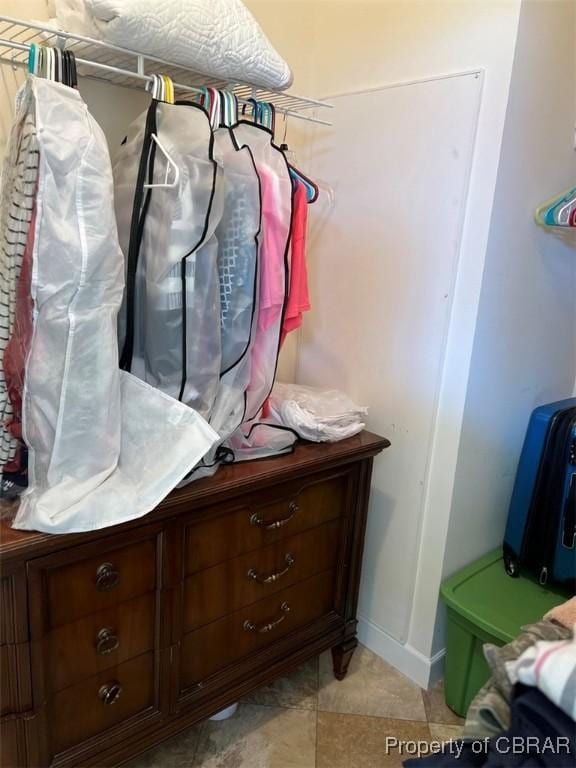 mudroom with baseboards and light tile patterned floors