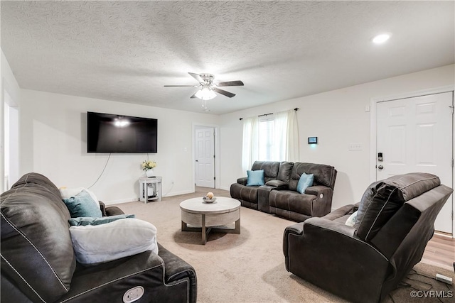 4721 Red Coach Ln, Sandston, VA 23150 - carpeted living area featuring a ceiling fan, a textured ceiling, and baseboards
