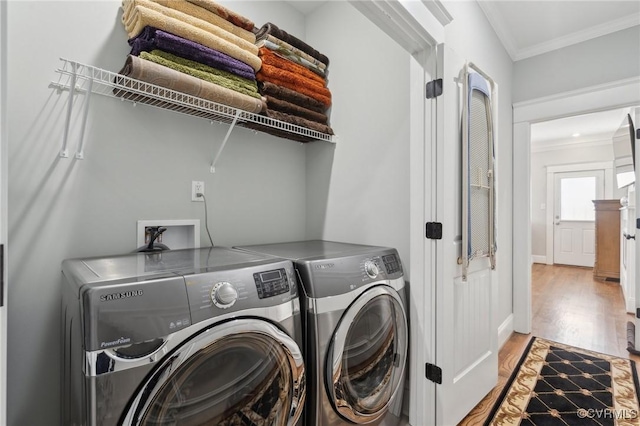 1910 Rose Ave, Richmond, VA 23222 - laundry room with crown molding, laundry area, independent washer and dryer, and wood finished floors