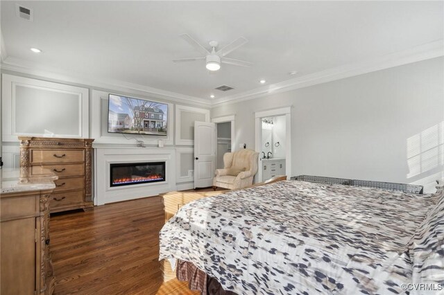 1910 Rose Ave, Richmond, VA 23222 - bedroom with visible vents, ornamental molding, wood finished floors, and a glass covered fireplace
