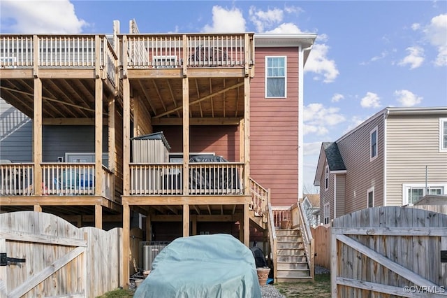 1910 Rose Ave, Richmond, VA 23222 - rear view of house featuring a wooden deck, a gate, stairs, and fence private yard
