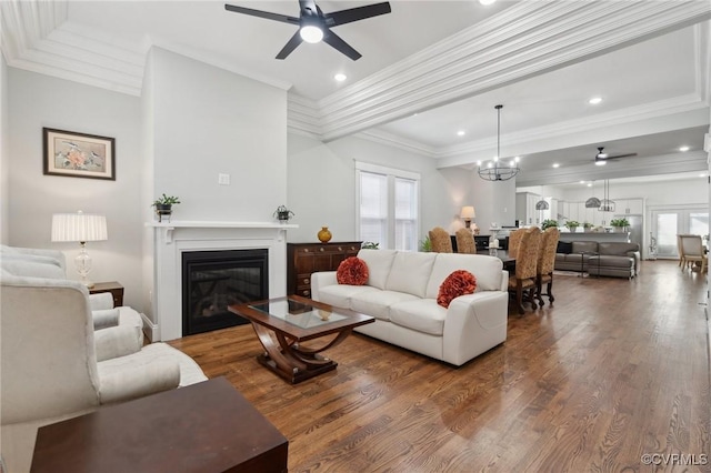 1910 Rose Ave, Richmond, VA 23222 - living area with a glass covered fireplace, crown molding, ceiling fan with notable chandelier, and wood finished floors