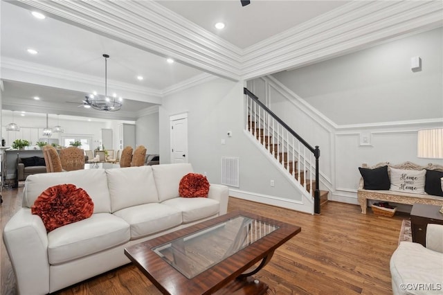 1910 Rose Ave, Richmond, VA 23222 - living room with ornamental molding, stairs, wood finished floors, and visible vents