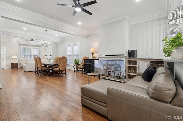 1910 Rose Ave, Richmond, VA 23222 - living room featuring crown molding, ceiling fan with notable chandelier, recessed lighting, and wood finished floors