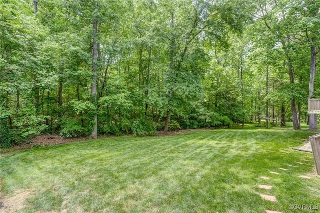 view of yard with a wooded view