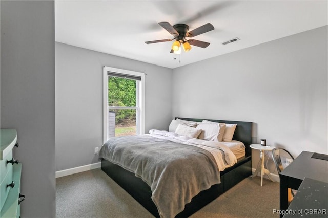bedroom featuring a ceiling fan, baseboards, visible vents, and carpet