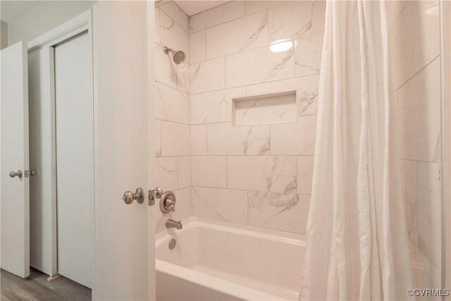 bathroom featuring shower / bath combination with curtain