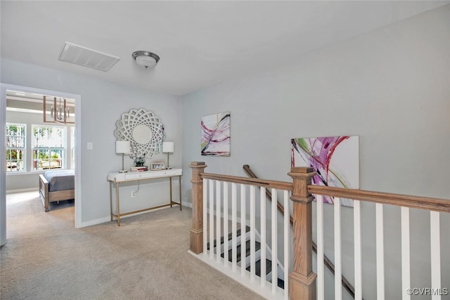 18731 Palisades Rdg, Moseley, VA 23120 - hall featuring carpet flooring, a notable chandelier, baseboards, an upstairs landing, and visible vents
