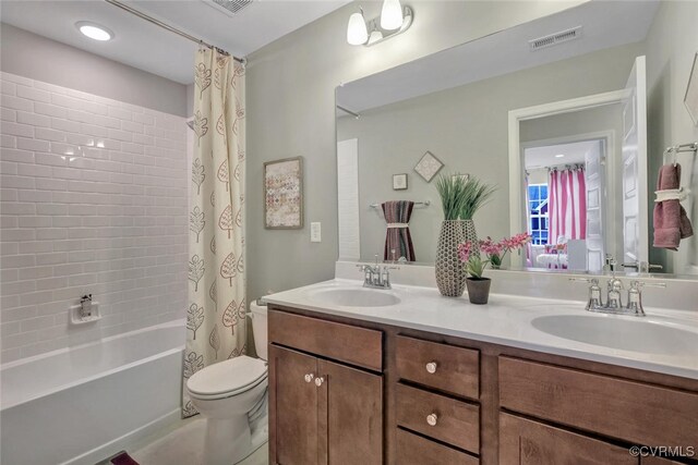 18731 Palisades Rdg, Moseley, VA 23120 - full bathroom with a sink, toilet, double vanity, and visible vents
