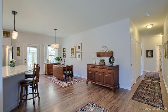 1676 Windsor Rd, Dutton, VA 23050 - dining area featuring dark wood-type flooring and baseboards