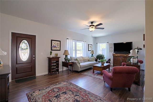 1676 Windsor Rd, Dutton, VA 23050 - living area featuring dark wood-style floors and a ceiling fan
