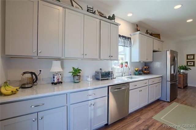 1676 Windsor Rd, Dutton, VA 23050 - kitchen featuring appliances with stainless steel finishes, dark wood finished floors, recessed lighting, and white cabinetry
