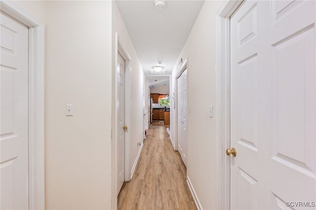 5841 Tuskwillow Dr, Richmond, VA 23832 - hallway with light wood-style floors and baseboards