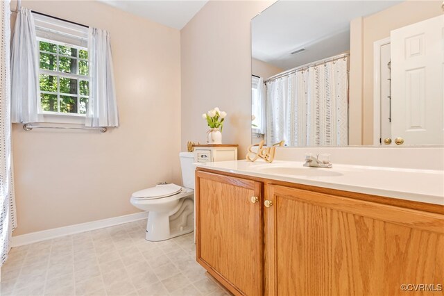 5841 Tuskwillow Dr, Richmond, VA 23832 - full bathroom with baseboards, vanity, toilet, and visible vents