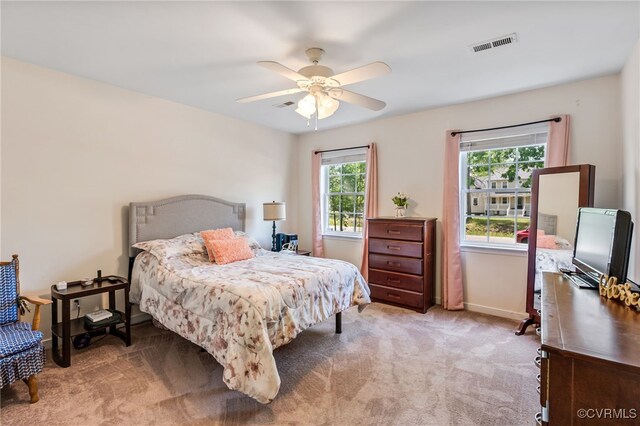 5841 Tuskwillow Dr, Richmond, VA 23832 - bedroom featuring carpet floors, a ceiling fan, visible vents, and multiple windows