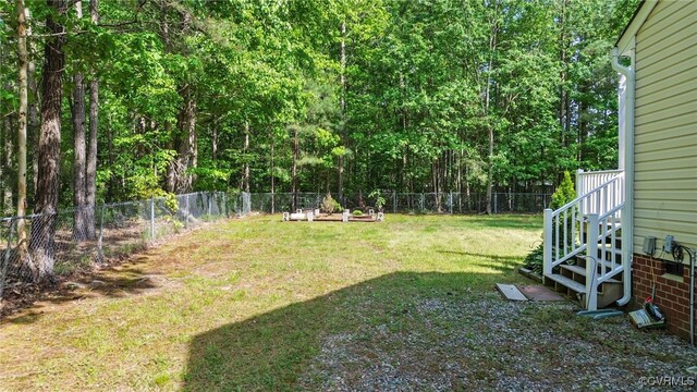 5841 Tuskwillow Dr, Richmond, VA 23832 - view of yard featuring stairway and a fenced backyard