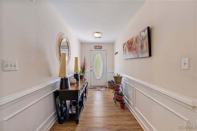 5841 Tuskwillow Dr, Richmond, VA 23832 - interior space featuring wainscoting, wood finished floors, and a decorative wall