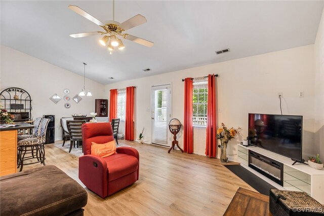 5841 Tuskwillow Dr, Richmond, VA 23832 - living area featuring visible vents, a ceiling fan, light wood-style flooring, and lofted ceiling