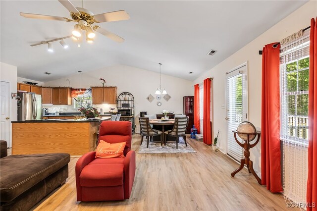 5841 Tuskwillow Dr, Richmond, VA 23832 - living room featuring ceiling fan, visible vents, rail lighting, lofted ceiling, and light wood-style floors