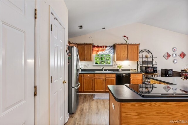 5841 Tuskwillow Dr, Richmond, VA 23832 - kitchen featuring lofted ceiling, black appliances, dark countertops, and brown cabinets