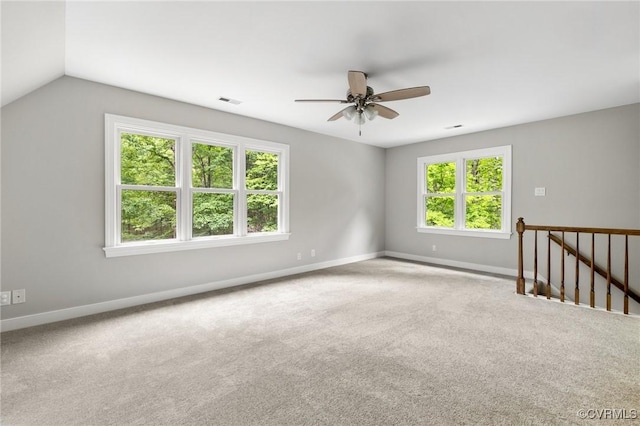 spare room featuring baseboards, a ceiling fan, carpet flooring, and visible vents