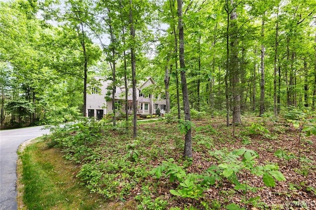 view of front facade with a view of trees