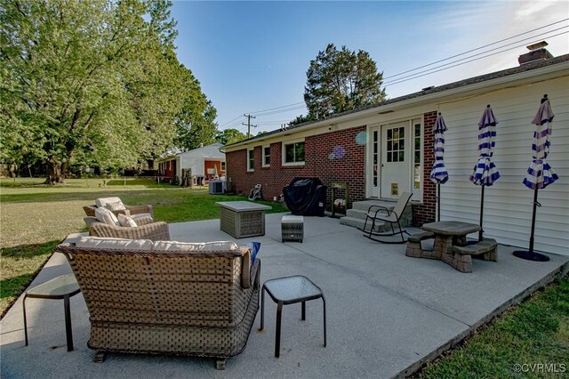 view of patio / terrace with central AC, an outdoor hangout area, and entry steps