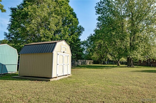 view of shed with a fenced backyard