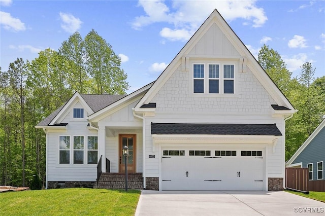 craftsman-style house with an attached garage, a front lawn, board and batten siding, and driveway