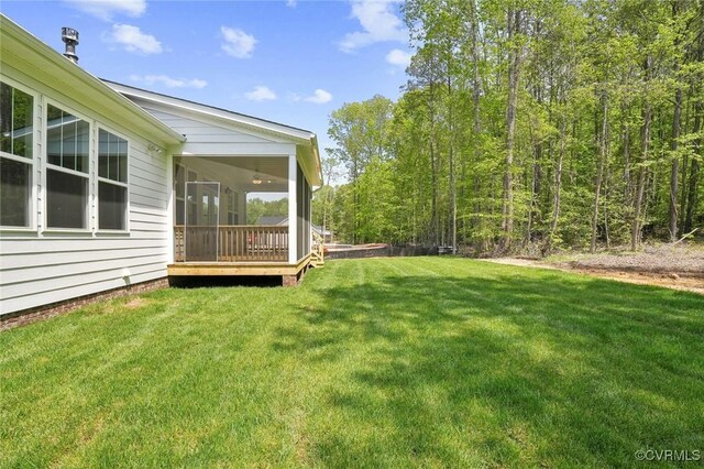 view of yard with a sunroom