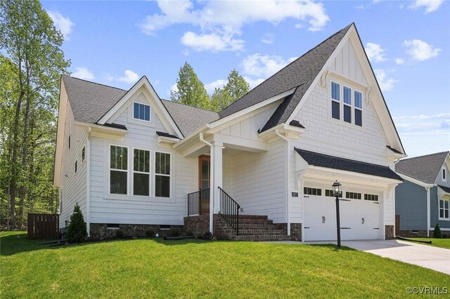 view of front facade featuring board and batten siding, a front yard, roof with shingles, and a garage