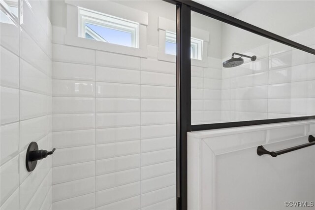 full bathroom with tiled shower
