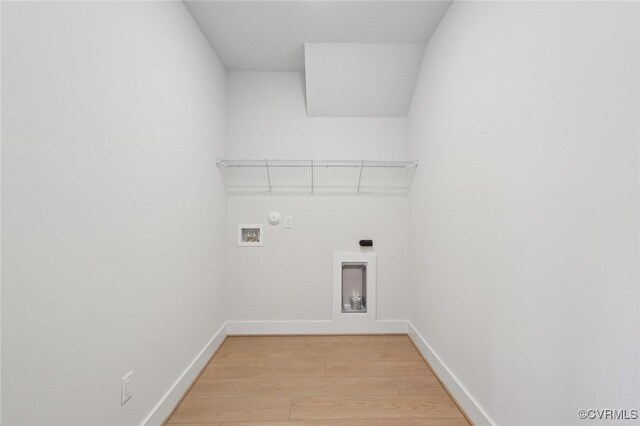 washroom with laundry area, washer hookup, light wood-style flooring, baseboards, and hookup for an electric dryer