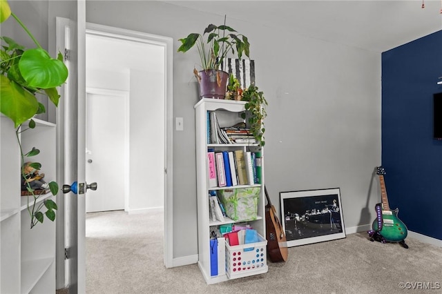 rec room featuring carpet floors and baseboards