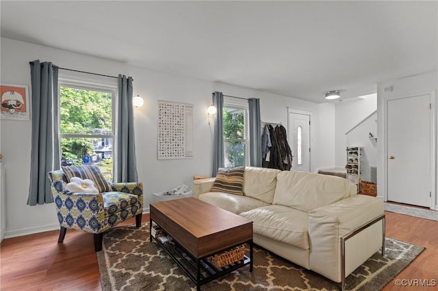 living room featuring baseboards and wood finished floors