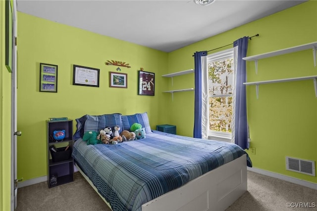 carpeted bedroom with baseboards and visible vents