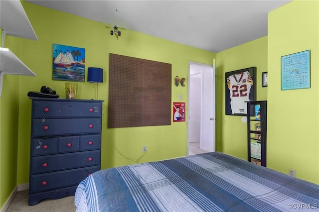 bedroom featuring carpet floors and baseboards