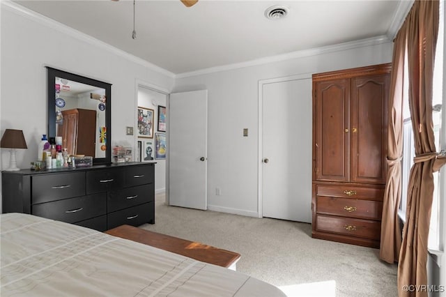 bedroom featuring crown molding, baseboards, light carpet, and visible vents