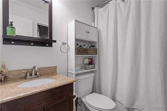 bathroom featuring crown molding, shower / bath combo with shower curtain, toilet, and vanity