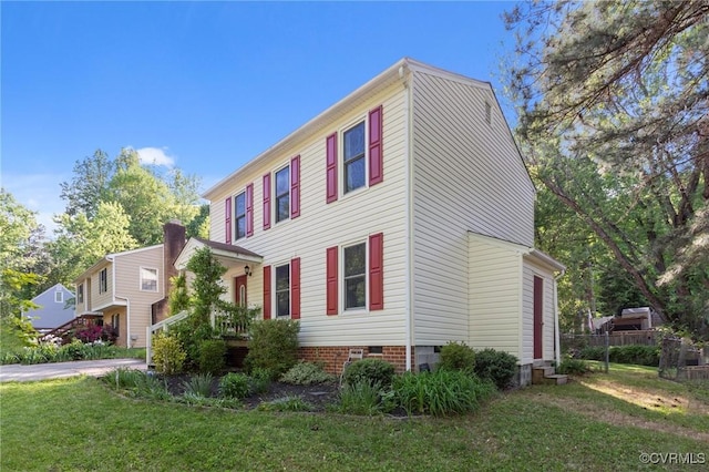 view of home's exterior featuring a yard and crawl space